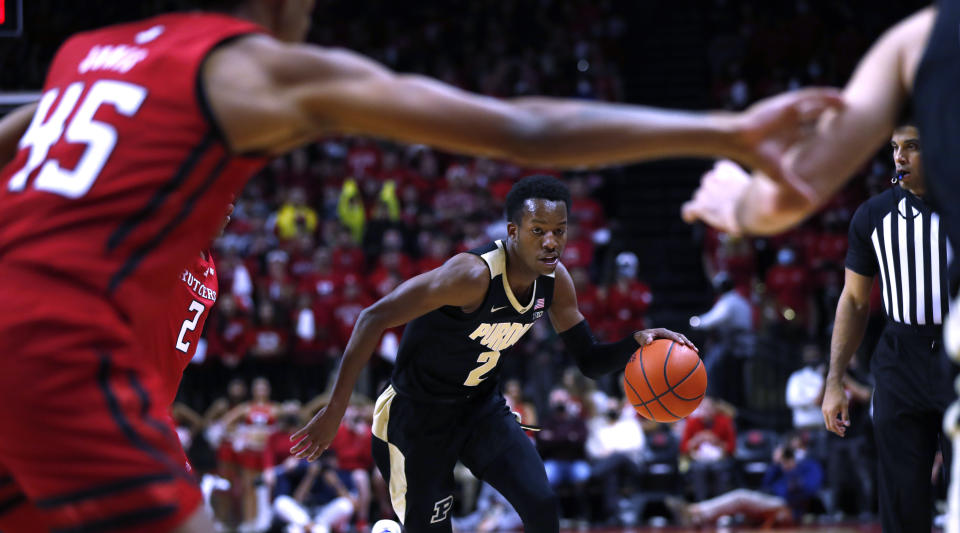 Purdue guard Eric Hunter Jr. (2) drives to the basket against Rutgers during the first half of an NCAA college basketball game in Piscataway, N.J., Thursday, Dec. 9, 2021. (AP Photo/Noah K. Murray)