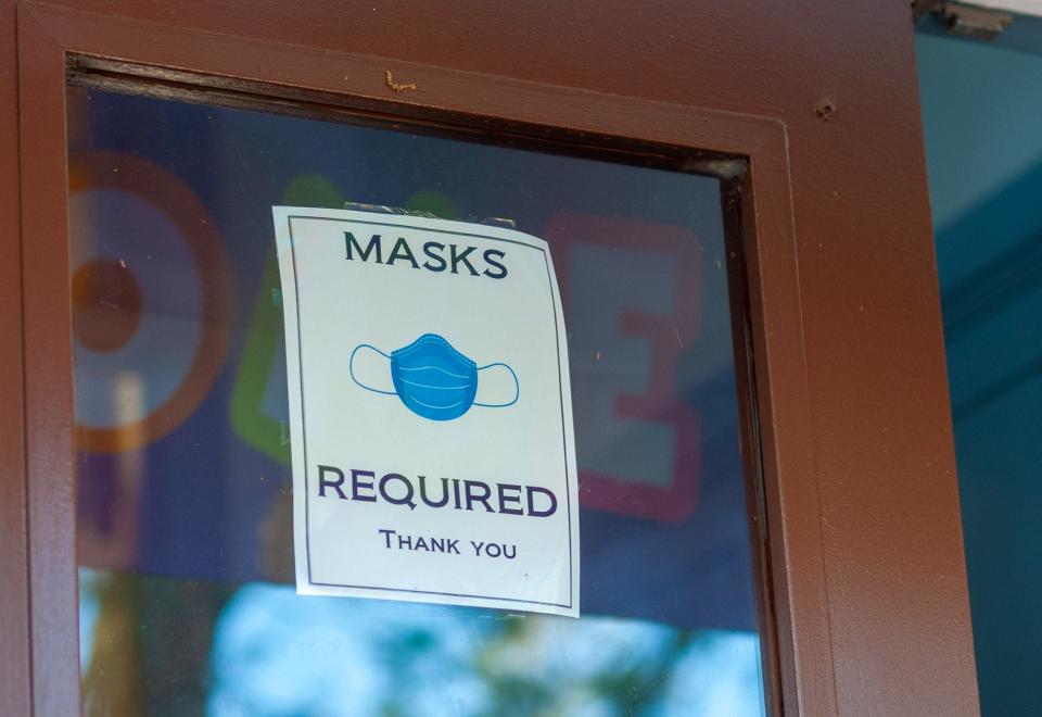 A sign warning of mask requirements hangs on the front door on the first day of school with masks being mandatory Tuesday, August 18, 2020 at Abrams Hebrew Academy in Yardley, Pennsylvania. According to Rabbi Ira Budow, the school is starting their semester early and has built three weeks into its schedule in case there is a COVID-19 stoppage. (WILLIAM THOMAS CAIN / PHOTOJOURNALIST)