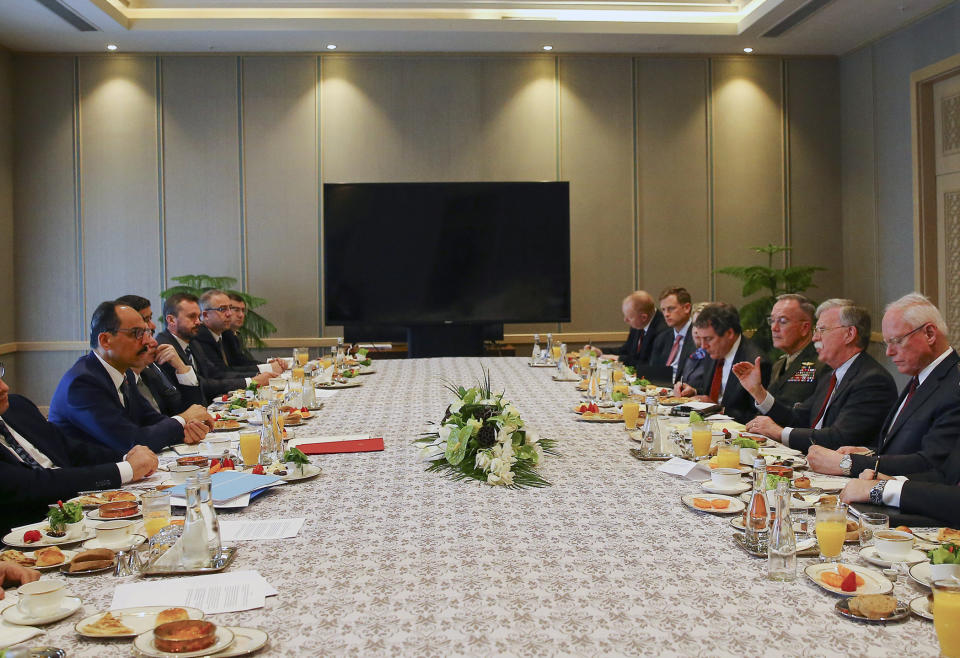 U.S. National Security Adviser John Bolton, 2nd right and his Turkish counterpart and senior adviser to President Recep Tayyip Erdogan, Ibrahim Kalin, left, head their delegations during a meeting at the Presidential Palace in Ankara, Turkey, Tuesday, Jan. 8, 2019. Bolton has said he is trying to negotiate the safety of Kurdish allies in northeastern Syria in the fight against the Islamic State group. (Presidential Press Service via AP, Pool)