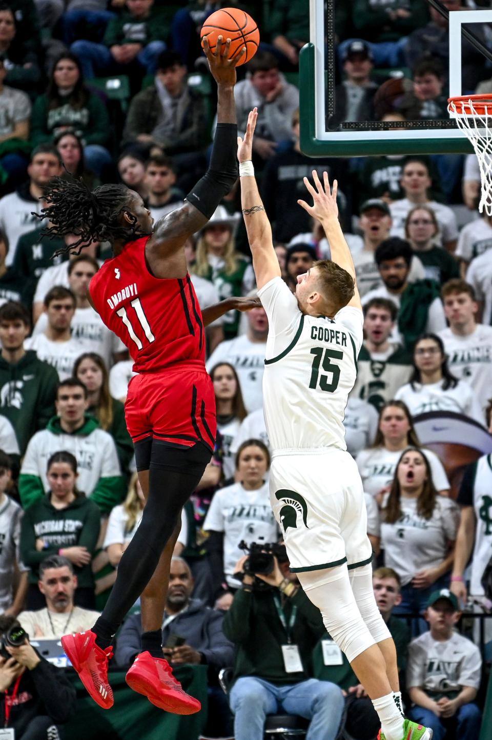 Michigan State's Carson Cooper, right, defends as Rutgers' Clifford Omoruyi shoots during the second half on Sunday, Jan. 14, 2024, at the Breslin Center in East Lansing.