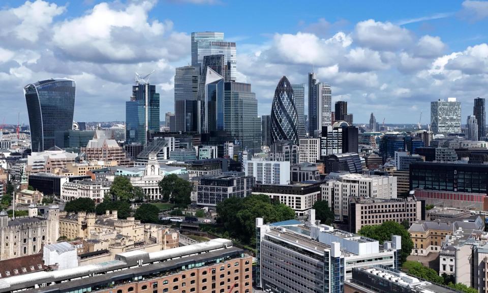 <span>The report found the IT and communications sector was making the most progress on net zero but just 52% of financial sector firms had signed up to the 2050 target.</span><span>Photograph: Neil Hall/EPA</span>