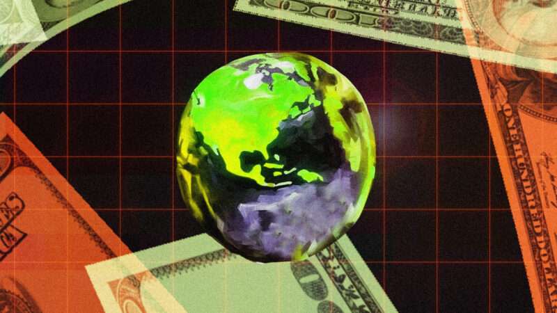 A globe is seen in front of $100 bills