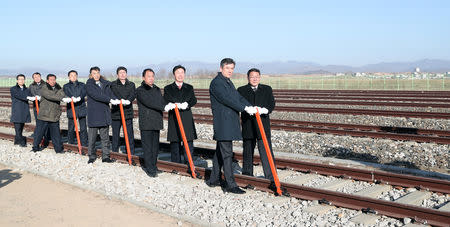 South and North Korean officials attend a groundbreaking ceremony for the reconnection of railways and roads at the Panmun Station in Kaesong, North Korea, December 26, 2018. Yonhap via REUTERS