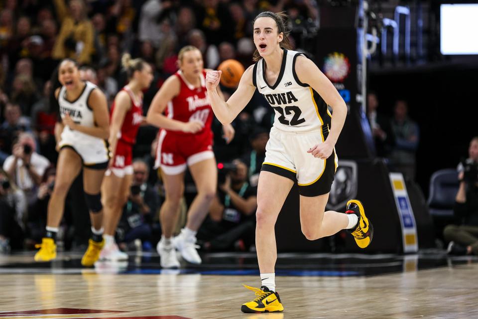 Iowa guard Caitlin Clark (22) celebrates her 3-pointer against Nebraska.