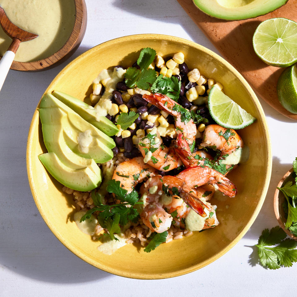 <p>This cilantro-lime shrimp bowl has tons of flavor and texture. The cilantro-lime shrimp is tangy and fresh, with brown rice and creamy avocado to balance the flavor. The two-chile cream sauce is easy to make and brings all the flavors of this bowl dinner together. <a href="https://www.eatingwell.com/recipe/7965781/cilantro-lime-shrimp-bowl/" rel="nofollow noopener" target="_blank" data-ylk="slk:View Recipe;elm:context_link;itc:0;sec:content-canvas" class="link ">View Recipe</a></p>