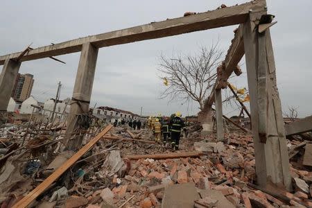 Rescue workers work at the site of a blast in Ningbo, Zhejiang province, China November 26, 2017. REUTERS/Stringer