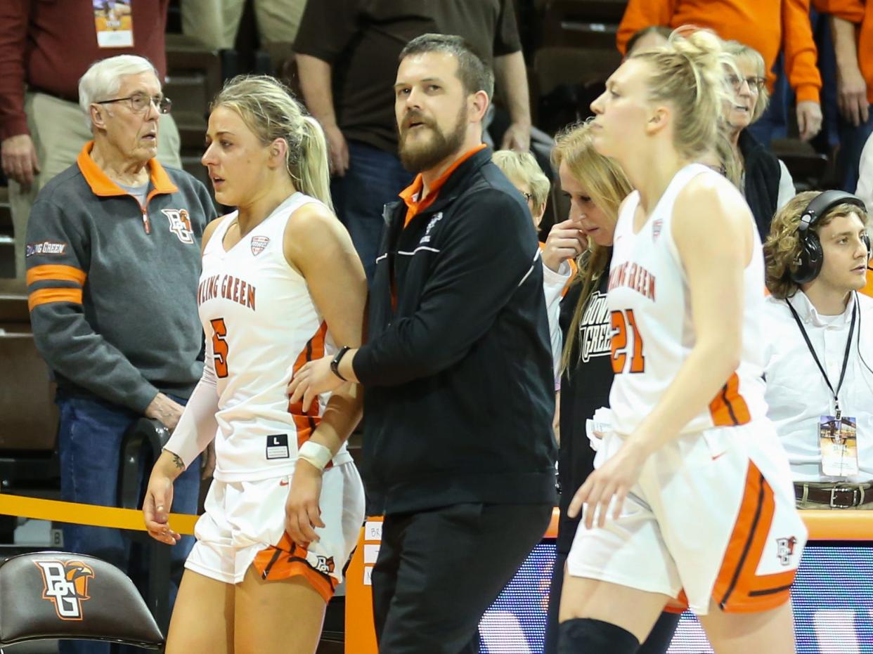 Bowling Green Falcons guard Elissa Brett (5), left, is assisted off of the court after an altercation with Memphis Tigers guard Jamirah Shutes (not pictured).