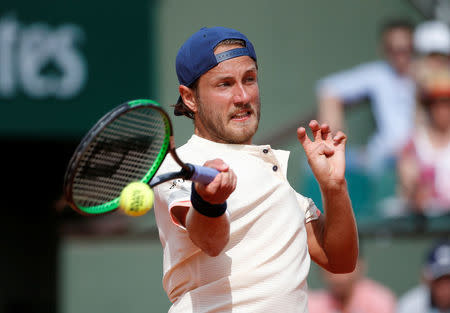 Tennis - French Open - Roland Garros, Paris, France - May 27, 2018 France's Lucas Pouille in action during his first round match against Russia's Daniil Medvedev REUTERS/Pascal Rossignol