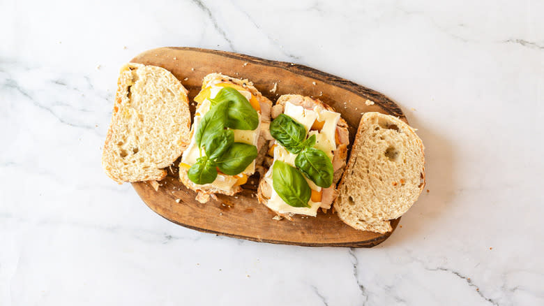 Bread with Brie, peach, basil on it