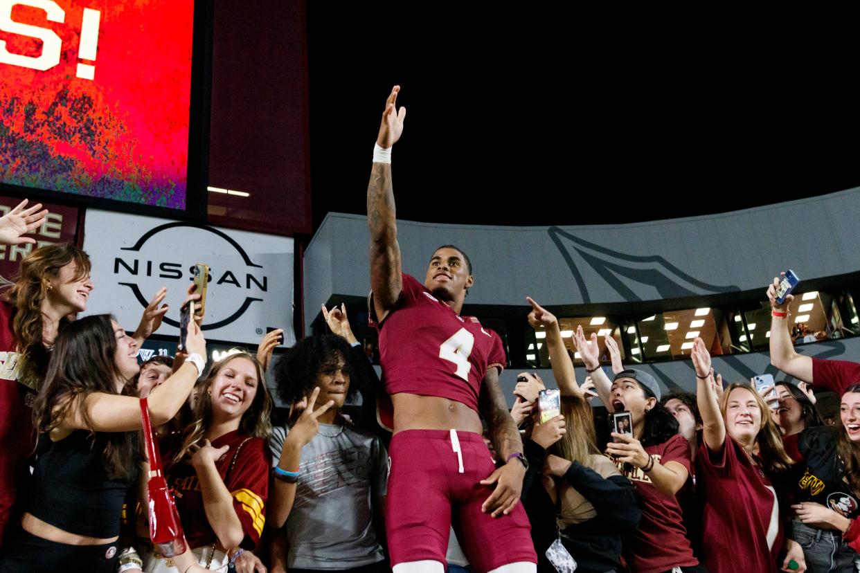 Nov 18, 2023; Tallahassee, Florida, USA; Florida State Seminoles wide receiver Keon Coleman (4) celebrates the win against the North Alabama Lions with fans at Doak S. Campbell Stadium. Mandatory Credit: Morgan Tencza-USA TODAY Sports