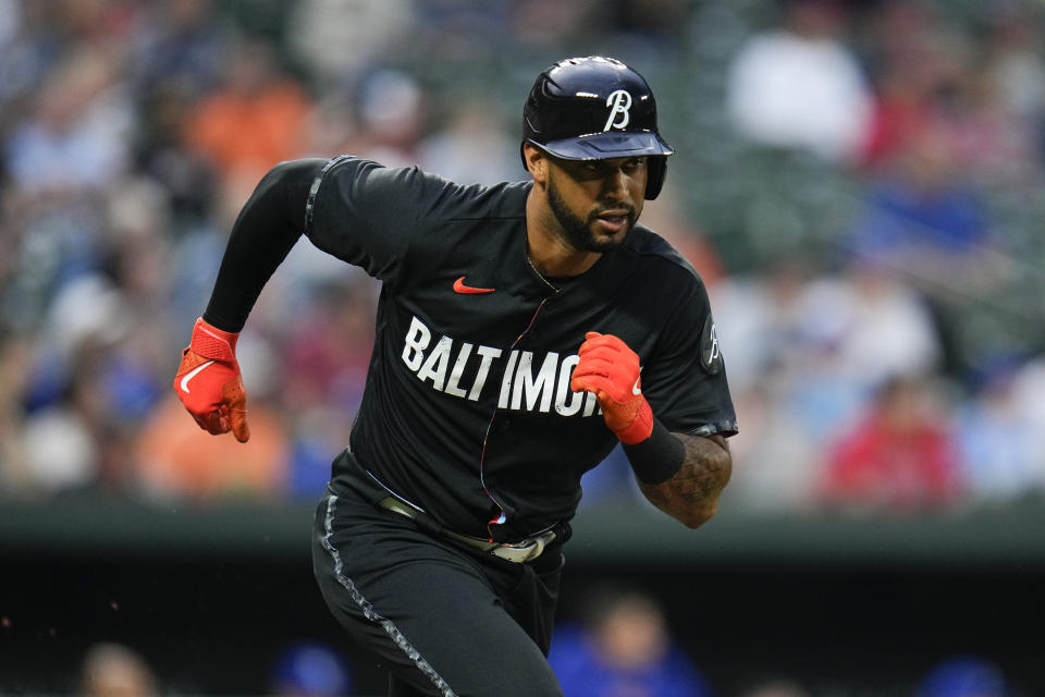 Baltimore Orioles' Aaron Hicks runs up the baseline after connecting for a single against the Kansas City Royals during the third inning of a baseball game, Monday, Jan. 4, 2021, in Baltimore. (AP Photo/Julio Cortez)