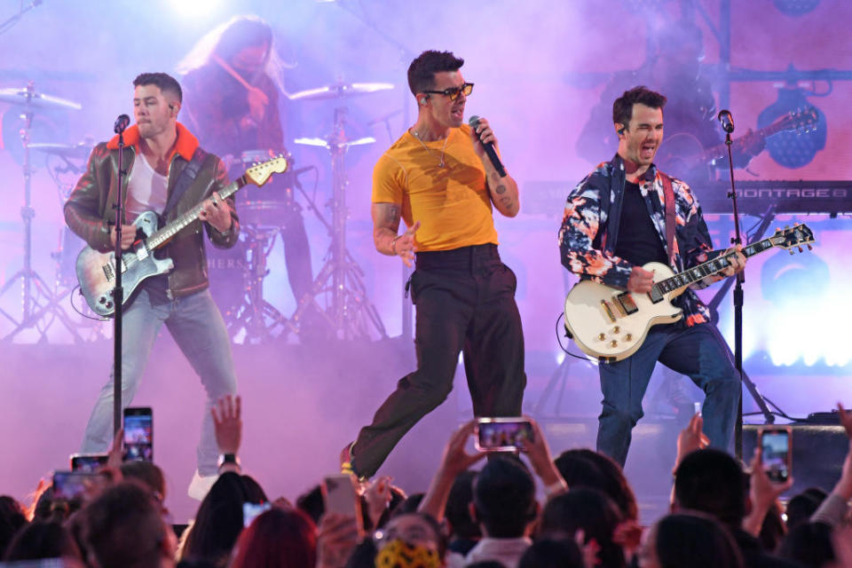 the Jonas Brothers performing onstage