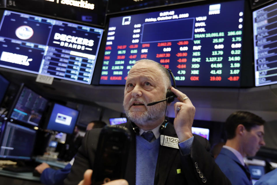 Trader Robert Moran works on the floor of the New York Stock Exchange, Friday, Oct. 26, 2018. Stocks are opening broadly lower on Wall Street, a day after a massive surge, as a number of big companies reported disappointing results. (AP Photo/Richard Drew)