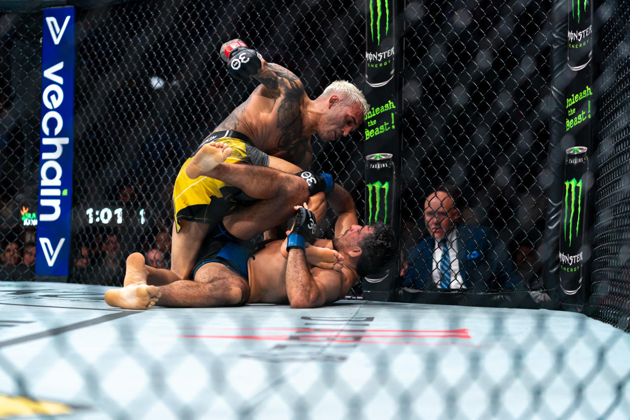 VANCOUVER, CANADA - JUNE 10: (Top) Charles Oliveira strikes (Bottom) Beneil Dariush during the UFC 289 event at Rogers Arena on June 10, 2023 in Vancouver, Canada. (Photo by Jordan Jones/Getty Images)