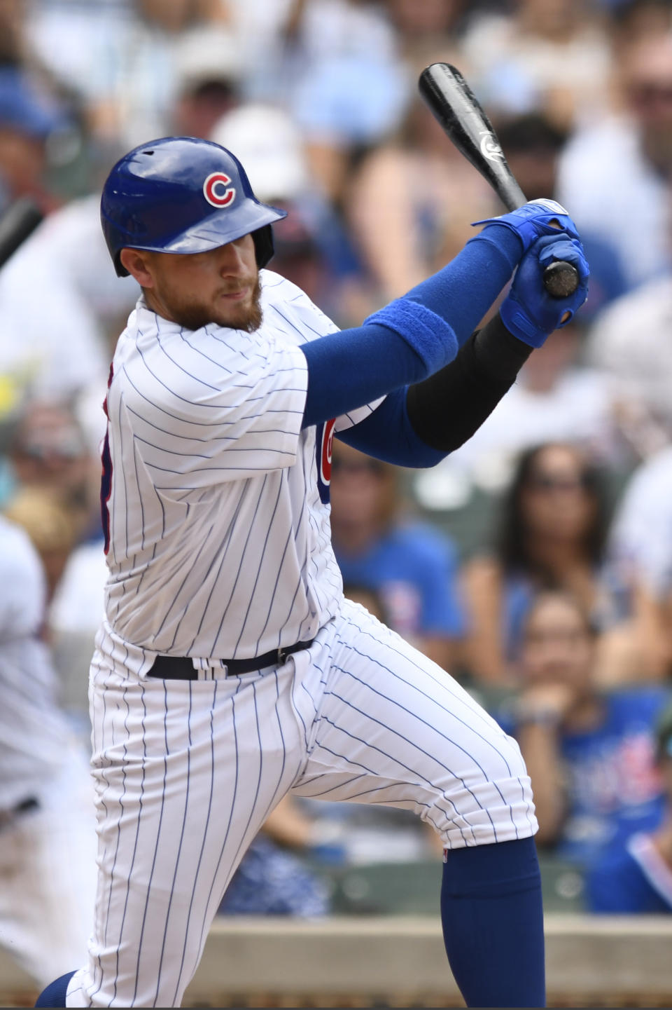 Chicago Cubs' P.J. Higgins watches his RBI single during the fifth inning of a baseball game against the Colorado Rockies, Saturday, Sept. 17, 2022, in Chicago. (AP Photo/Paul Beaty)