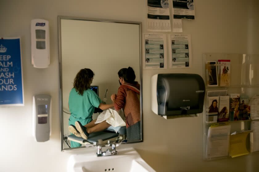 ALBUQUERQUE, NM - JUNE 23, 2022: A family physician and her resident perform an ultrasound on a 39-year-old woman who already has four children the day before the Supreme Court overturned Roe v. Wade at the Center for Reproductive Health clinic on June 23, 2022 in Albuquerque, New Mexico. She later had a surgical abortion at the clinic. New Mexico will see an influx of patients from neighboring states which have banned abortion. The doctor does not want to be identified for security reasons.(Gina Ferazzi / Los Angeles Times)