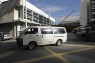 An ambulance comies out of the forensic department at Kuala Lumpur Hospital in Kuala Lumpur, Malaysia, Saturday, Feb. 25, 2017. According to police Friday, forensics stated that the banned chemical weapon VX nerve agent was used to kill Kim Jong Nam, the North Korean ruler's outcast half brother who was poisoned last week at the airport. (AP Photo/Daniel Chan)