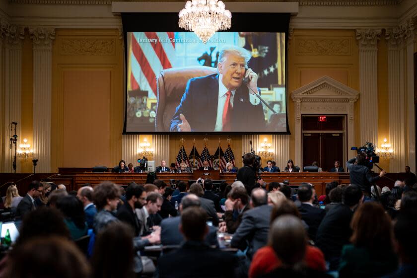 WASHINGTON, DC - DECEMBER 19: An image of President Donald Trump is displayed on a screen as the House Select Committee to Investigate the January 6th Attack on the United States Capitol conducts its final hearing in the Cannon House Office Building on Monday, Dec. 19, 2022 in Washington, DC. The bipartisan Select Committee to Investigate the January 6th Attack On the United States Capitol has spent over a year conducting more than 1,000 interviews, reviewed more than 140,000 documents day of the attack. (Kent Nishimura / Los Angeles Times)