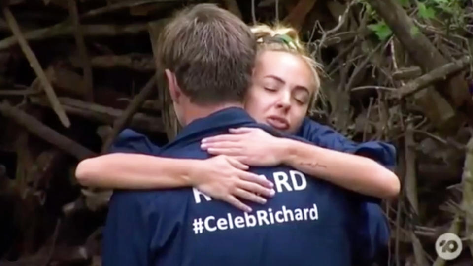 A photo of Angie Kent and Richard Reid sharing a hug on I'm A Celebrity Get Me Out Of Here 2019. Photo: Channel 10.