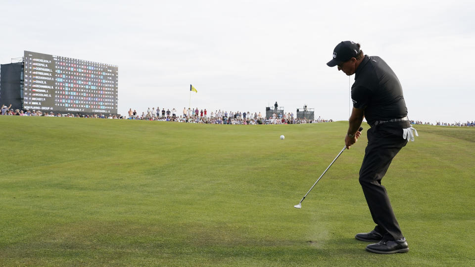 Phil Mickelson chips to the 18th green during the third round at the PGA Championship golf tournament on the Ocean Course, Saturday, May 22, 2021, in Kiawah Island, S.C. (AP Photo/Chris Carlson)