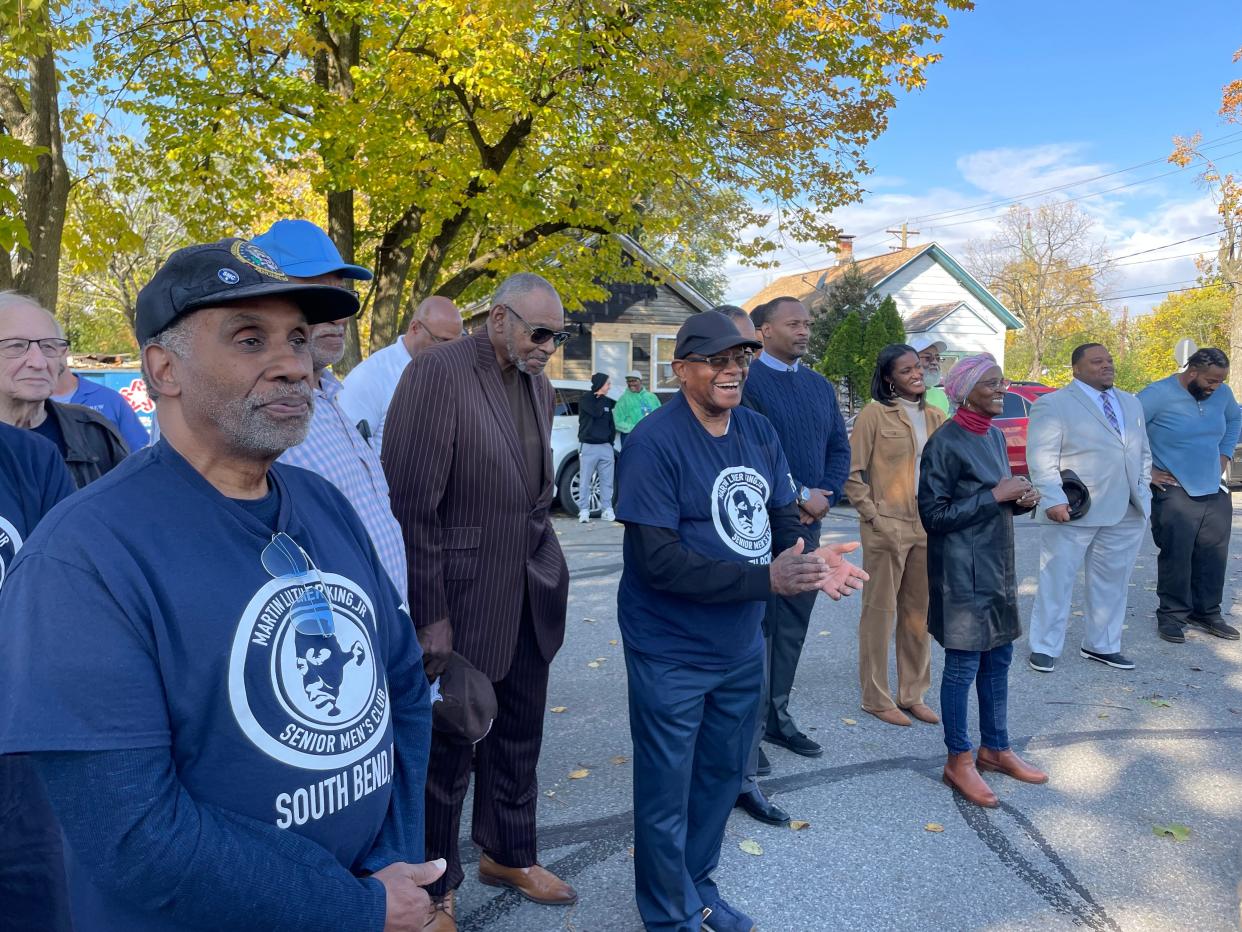 Residents, including Martin Luther King Jr. Senior Men's Club member Mike Jackson, at left, applaud during an Oct. 24, 2023, ceremony announcing a construction timeline for the new Dream Center.