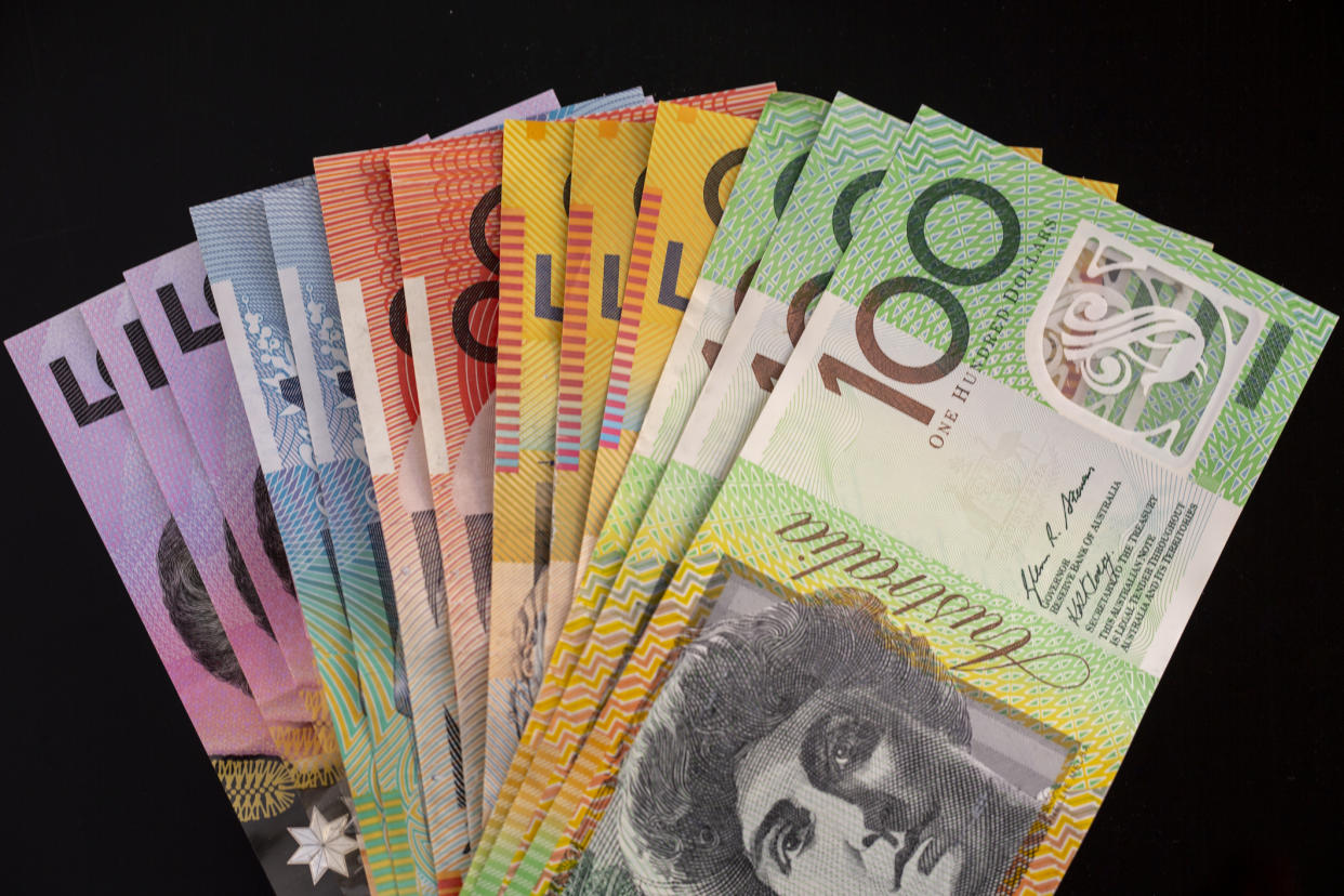 A variety of Australian lotto winnings cash on a black background. Image: Getty