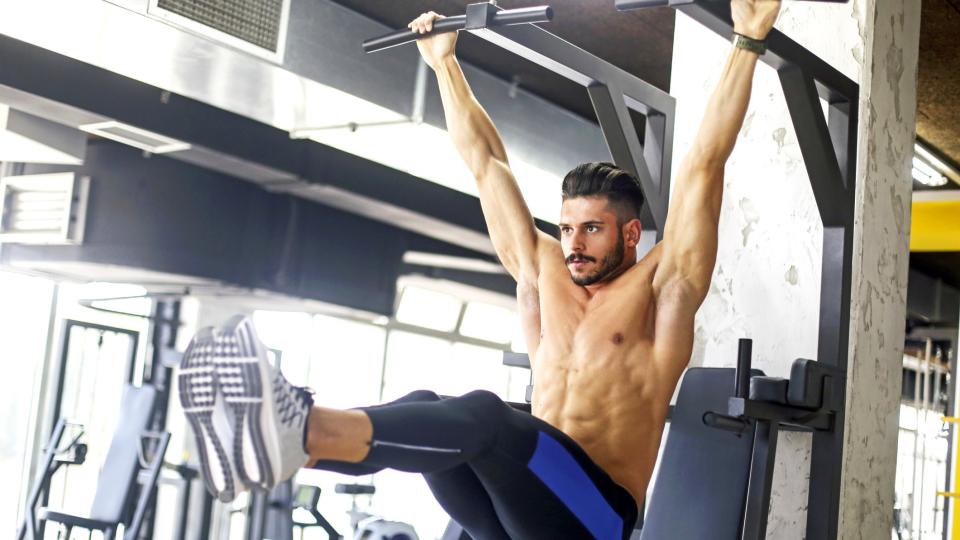 Man doing hanging leg raises