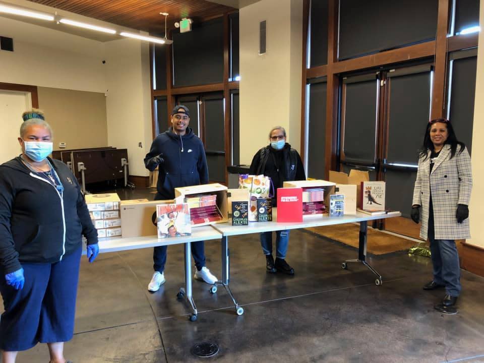 Dr. Sheryl Davis (far right) with community members at a food giveaway.