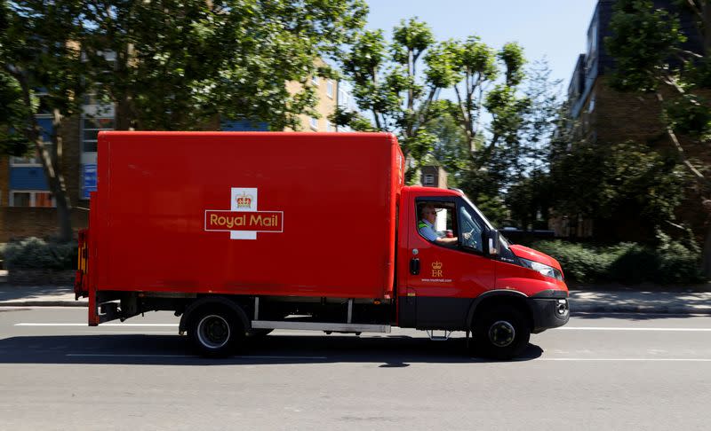 A delivery vehicle drives along a road near Mount Pleasant, in London