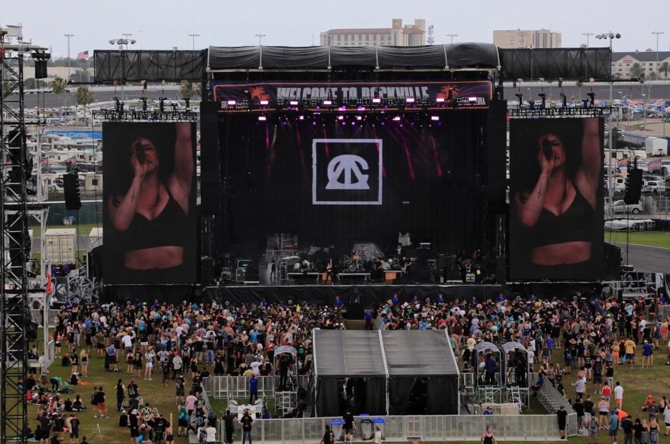 Against the Current performs on Saturday afternoon at the Welcome to Rockville music festival at Daytona International Speedway.  Later in the day, the event again was besieged by a series of severe thunderstorms that forced the show to shut down early before the scheduled headlining set by Guns N' Roses.