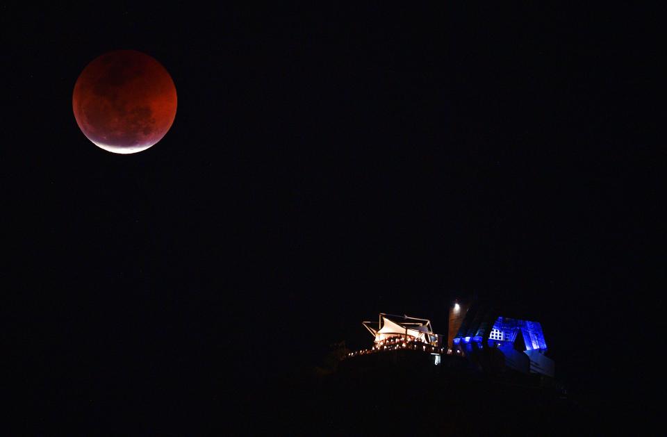 <p>View of a moon eclipse over the Sugar Loaf mountain in Rio de Janeiro, Brazil on July 27, 2018. (Photo: Carl de Souza/AFPGetty Images) </p>