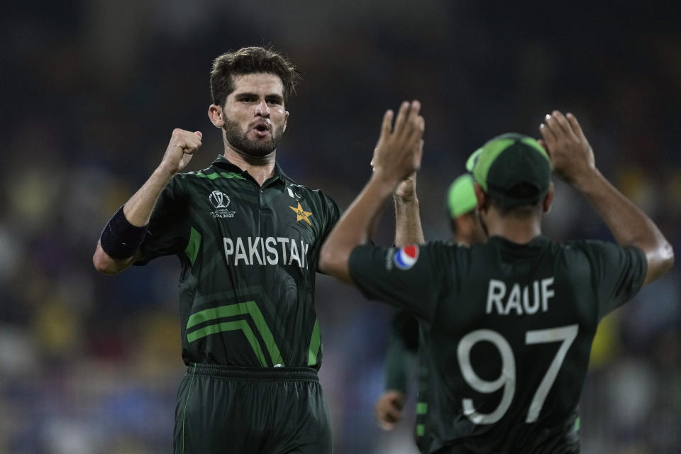 Pakistan's Shaheen Afridi celebrates the wicket of South Africa's Gerald Coetzee with teammates during the ICC Men's Cricket World Cup match between Pakistan and South Africa in Chennai, India, Friday, Oct. 27, 2023. (AP Photo/Ajit Solanki)