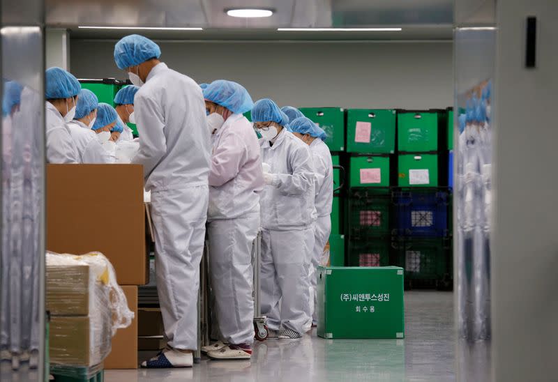 Employees work at a mask factory in Icheon