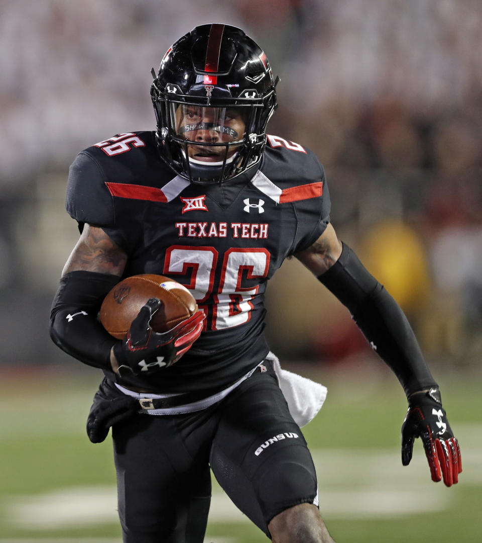 Texas Tech's Ta'Zhawn Henry (26) runs the ball to score a touchdown during the first half of an NCAA college football game against Oklahoma, Saturday, Nov. 3, 2018, in Lubbock, Texas. (AP Photo/Brad Tollefson)