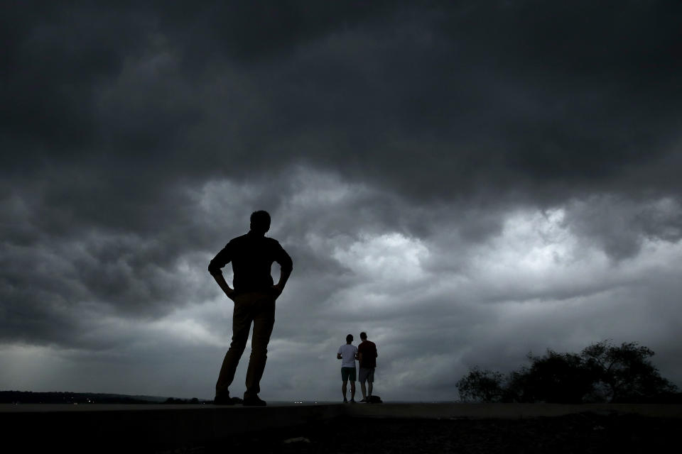 People watch from the Liberty Memorial as a severe storm that dropped several tornados earlier approaches downtown Kansas City, Mo., on Tuesday, May 28, 2019. (AP Photo/Charlie Riedel)