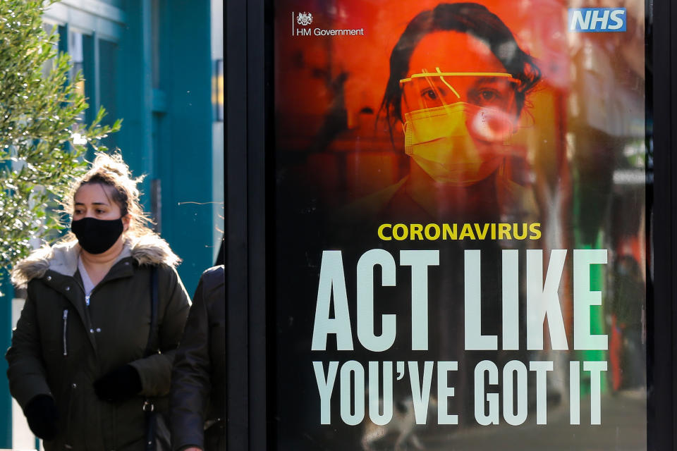 A woman walks past the 'Act Like You've Got It' coronavirus campaign advert in London. (Photo by Dinendra Haria / SOPA Images/Sipa USA)