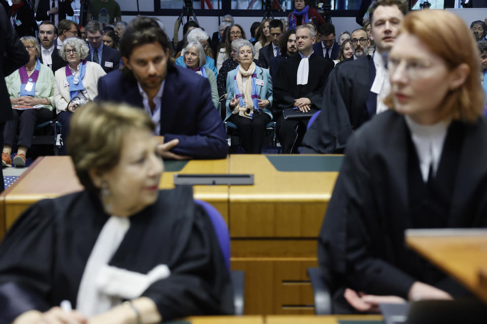 Lawyers and members of the public attend the ruling at the European Court of Human Rights , Tuesday, April 9, 2024 in Strasbourg, eastern France. Europe's highest human rights court threw out cases brought by six Portuguese youths and a French mayor aimed at forcing countries to meet international obligations to reduce greenhouse gas emissions, but sided with a group of senior Swiss women who also sought such measures.(AP Photo/Jean-Francois Badias)