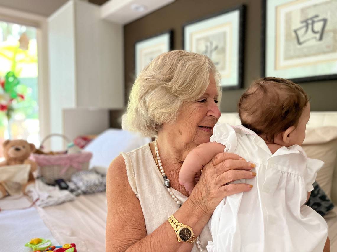 Karin Van Name, 91, of Hilton Head, has taken care of 100 babies in over 30 years as a foster parent both in New York and South Carolina. Here, she cuddles her newest foster baby, a 5-month-old baby girl.