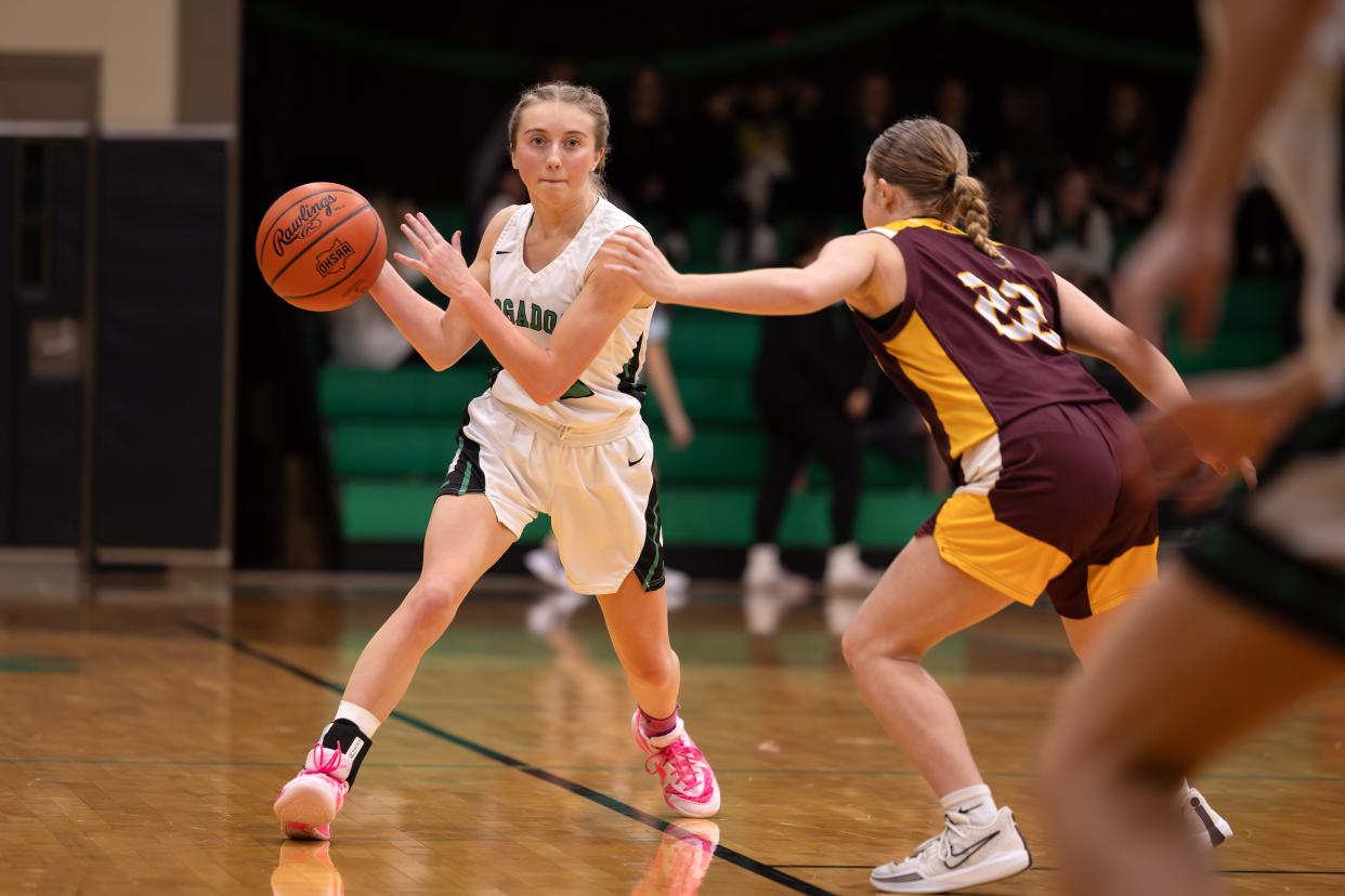Mogadore's Brook McIntyre goes to pass the ball during Wednesday night’s basketball game at Mogadore High School.
