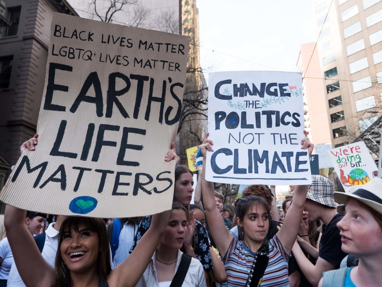 Children holding placards as they march in Melbourne, Australia: Asanka Ratnayake/Getty Images