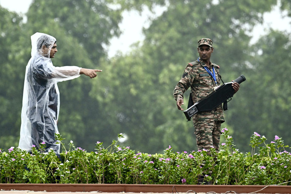 Security people guard at Rajghat, a Mahatma Gandhi memorial, where G20 leaders will be visiting to pay their respects in New Delhi, India, Sunday, Sept. 10, 2023. (AP Photo/Kenny Holston, Pool)