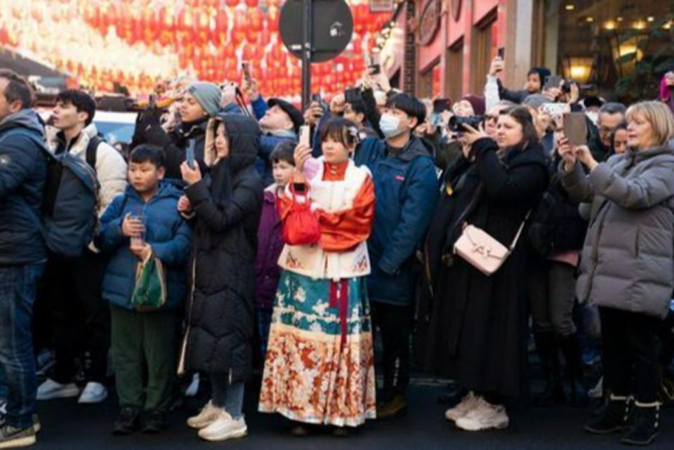 Chinese new year 1.jpg: Spectators watch the parade during the Chinese New Year celebrations in London (PA)