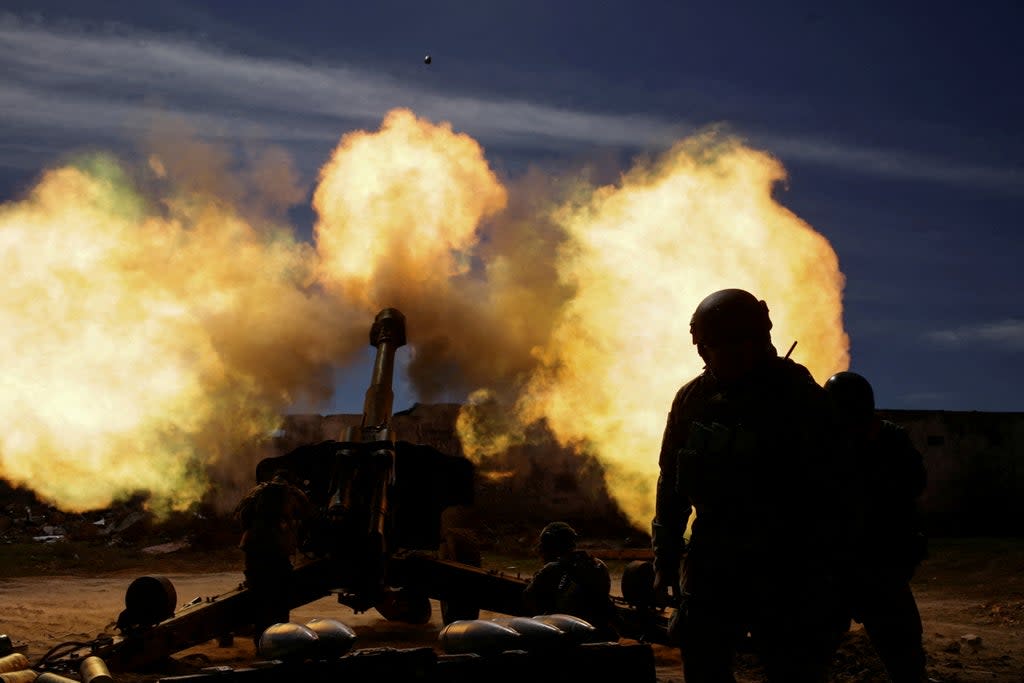 File photo:  Members of the Ukrainian Volunteer Corps fire with a howitzer during the Russian invasion  (Reuters)