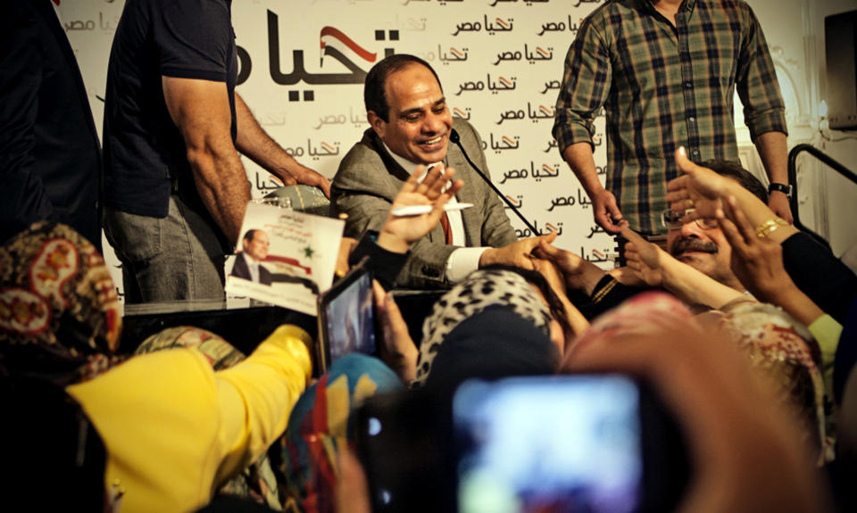 This Monday, May 5, 2014 photo released by the presidential campaign of Abdel-Fattah el-Sissi shows the candidate greeting supporters at a gathering of some 600 women in Cairo, Egypt. El-Sisi acknowledged the importance of Egyptian women in shaping the nation's history and building the nation’s future according to campaign officials. (AP Photo/El-Sissi for President)