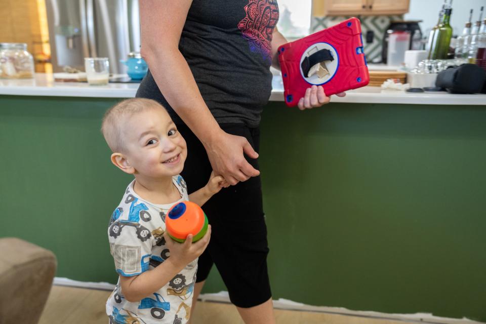 Tobias and mom Charity Deleon at home in Port St. Lucie. The family moved north from Greenacres as financial strains grew.