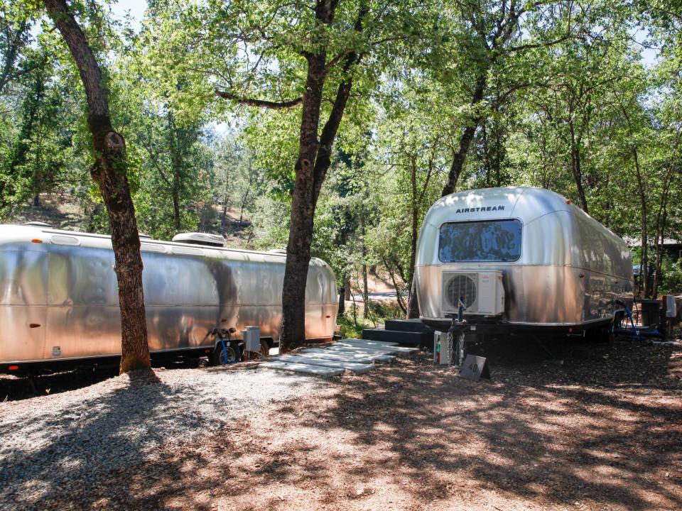 Autocamp Yosemite's Airstream suites under shade and trees