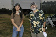 Chloe Zhao, left, and Stephen Gilula attend the Telluride from Los Angeles drive-in screening of "Nomadland" on Friday, Sept. 11, 2020, at the Rose Bowl in Pasadena, Calif. (Richard Shotwell/Invision/AP)