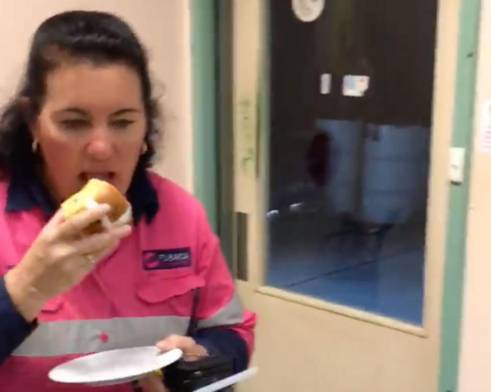 Ms Jones takes a bite as she warns drivers to be careful. Source: Facebook/ Pilbara Heavy Haulage Girls Inc.