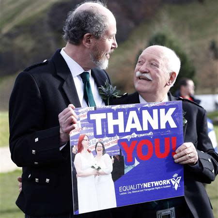 Larry Lamont and Jerry Slater (L) take part in a symbolic same-sex marriage outside the Scottish Parliament in Edinburgh, Scotland February 4, 2014. REUTERS/Russell Cheyne