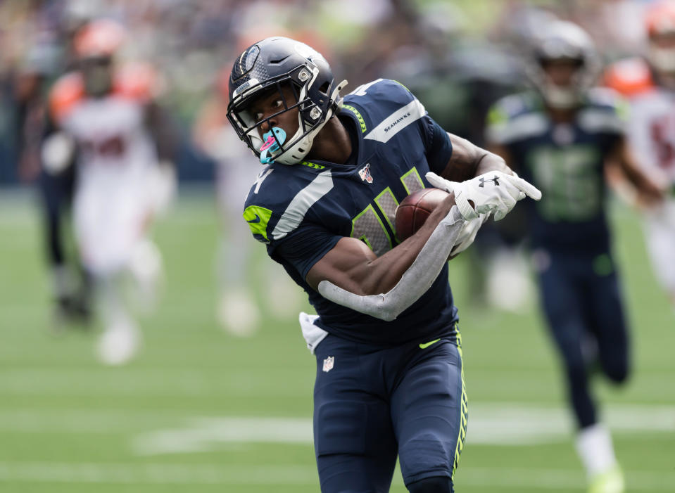 Sep 8, 2019; Seattle, WA, USA; Seattle Seahawks wide receiver D.K. Metcalf (14) carries the ball after catching a pass against the Cincinnati Bengals during the first half at CenturyLink Field. Mandatory Credit: Steven Bisig-USA TODAY Sports